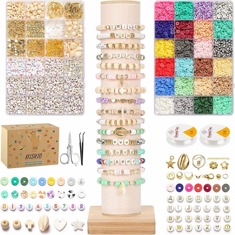 The Fashiongirl Clay Beads / Heishi Beads Bohemian Kit (KREA DIY Jewellery Kit) includes 6000 assorted beads, charms, letter beads, string spools, scissors, vibrant jewellery samples on display stands, storage boxes, and a product box.