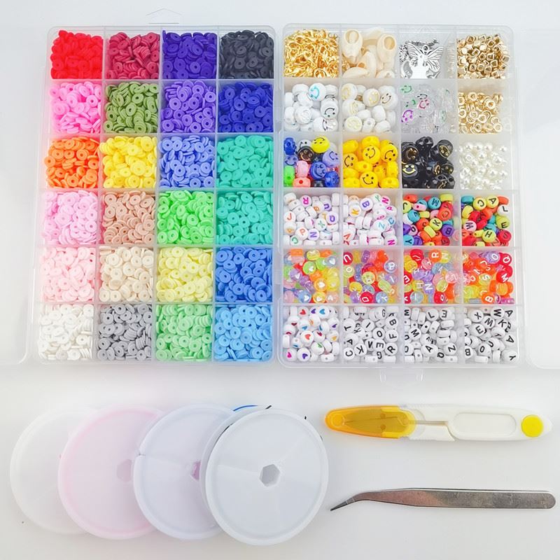 The Fashiongirl Clay Beads / Heishi Beads Merkki Kit - KREA DIY Jewellery Kit includes 7000 colorful, assorted beads sorted in an organizer box with three empty containers, a yellow-handled needle, and metal tweezers on a white surface.