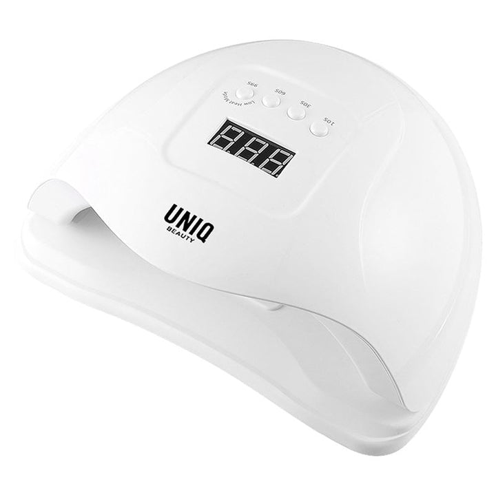 The UNIQ Nail Starter Kit includes an 80W UV/LED dryer with a digital timer display and control buttons, ideal for curing gel nails—an essential tool from UNIQ for beginner or pro nail enthusiasts.