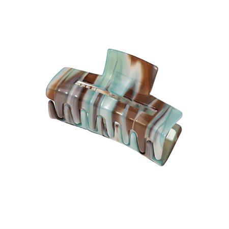 The SOHO Aria Hair Claw - Pearl Green by SOHO offers a marbled acetate finish, curved design, and interlocking teeth for a secure and stylish hold.