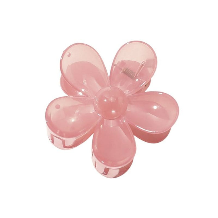 La pince à cheveux SOHO Fiore Hair Claw en rose charme présente un motif floral translucide à six pétales. Il s'agit d'un accessoire élégant de SOHO qui mettra en valeur n'importe quelle coiffure.