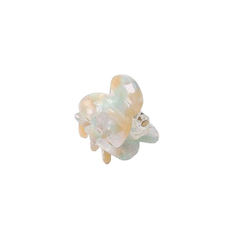 The SOHO Hara Mini Hair Claw - Beach by SOHO is a small, pastel iridescent hair clip with a rounded design and gold hinge for secure grip, shown against a white background.