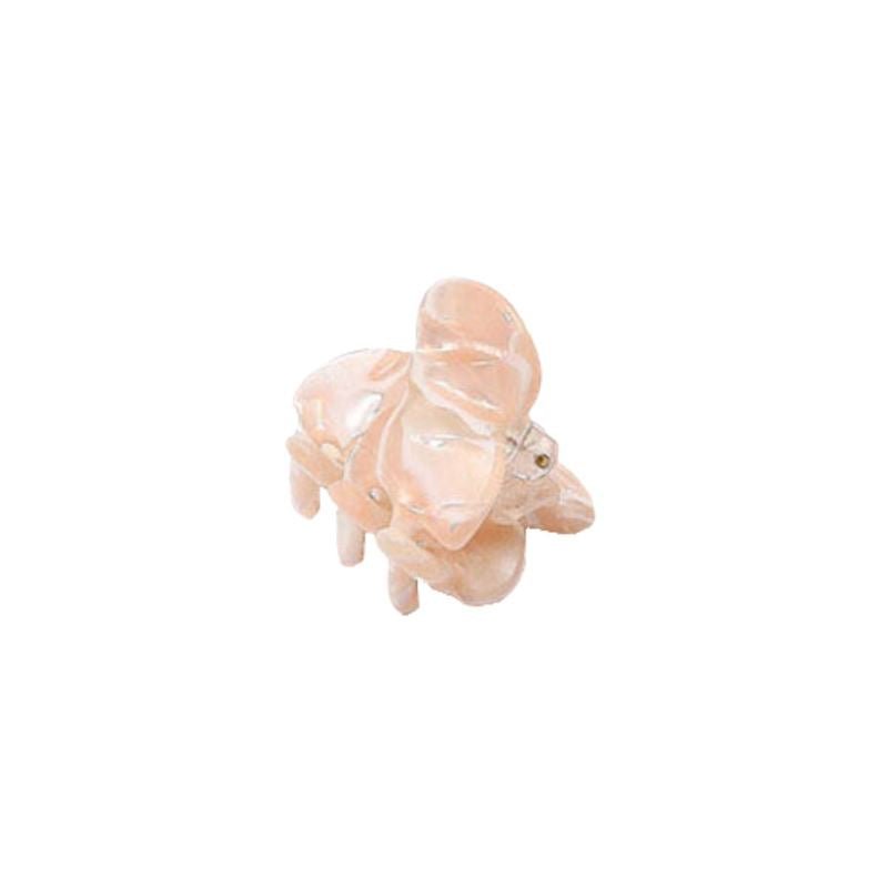 The SOHO Hara Mini Hair Claw in Cloud Pink from SOHO is a small, glossy, elephant-shaped hair accessory resembling a figurine, displayed on a white background.