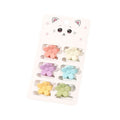 Les mini-barrettes SOHO Lala - Fleurs pastel de SOHO comprennent six barrettes florales pastel en rose, jaune, violet, bleu, orange et vert, présentées sur une carte avec une jolie illustration de chat.