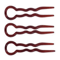 Le lot de 3 épingles à cheveux SOHO Twist Chignon comprend des épingles brunes ondulées avec des poignées circulaires disposées sur un fond blanc, idéales pour fixer votre chignon ou votre coiffure préférée.