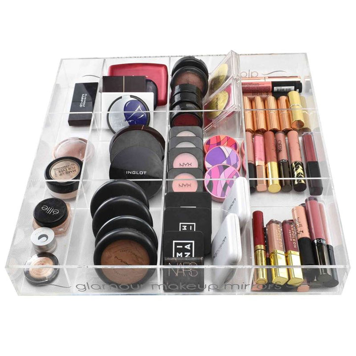 The UNIQ Acrylic Organiser tray for makeup/jewellery by UNIQ features 12 compartments to neatly store powders, blushes, eyeshadows, lipsticks, and glosses for efficient and organised makeup storage.