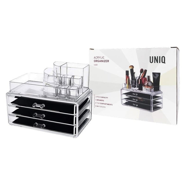 The UNIQ Make up organiser - 3 drawers SF-1303 (U320), a clear plastic organiser with multiple top compartments, is shown beside its box displaying the filled organiser and the UNIQ brand name.