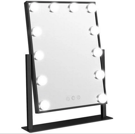 The UNIQ New York Mega Makeup Mirror by UNIQ features a black rectangular frame, twelve round LED bulbs, a black stand, and three touch buttons at the bottom center.