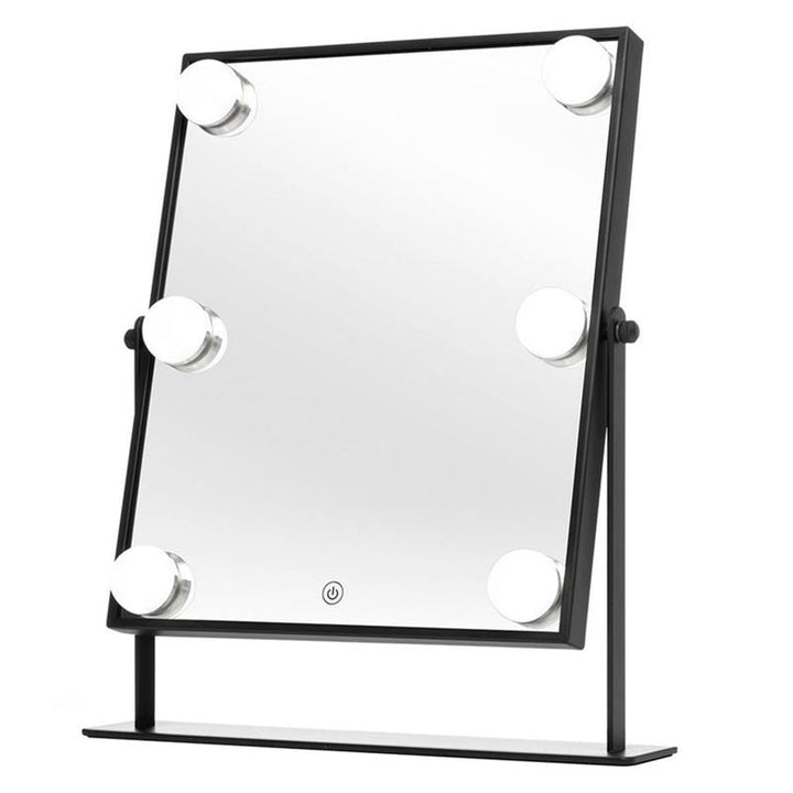 The UNIQ XL Hollywood Mirror with LED Lights & Touch Control by UNIQ features a sleek black frame, six round LED lights, and a touch power button. It includes a sturdy stand, making it perfect for your makeup routine.